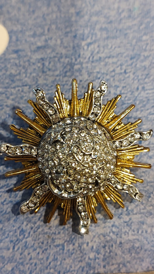 Broche sol