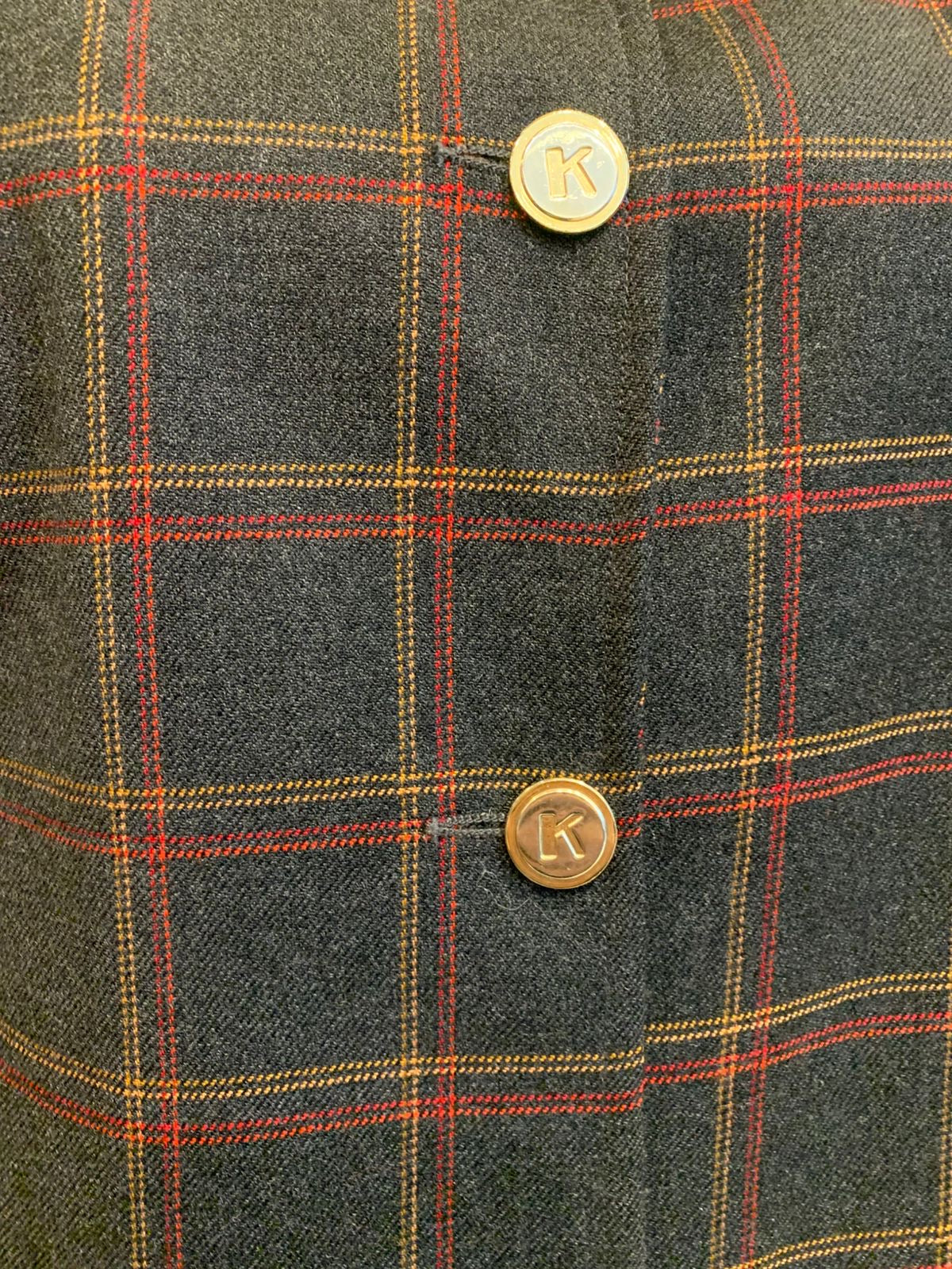 Conjunto de lã xadrez com saia de listra
