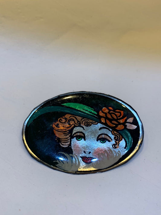 Broche mulher