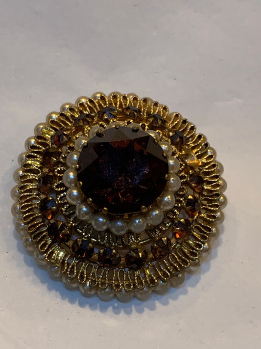 Broche redondo dourado